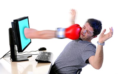 Computer throwing punches at a man