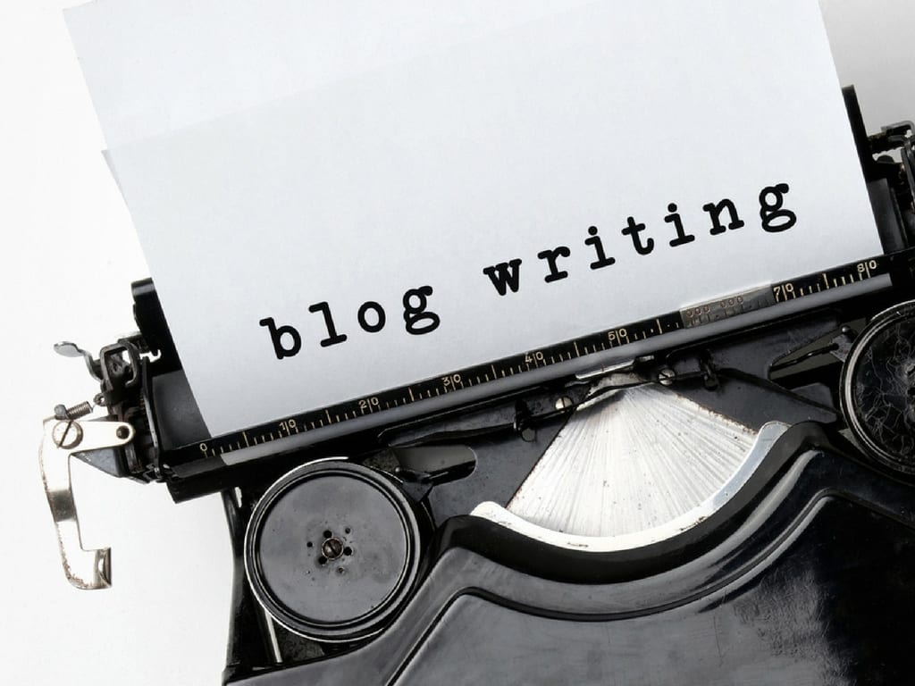 Paper in typewriter that says Blog Writing