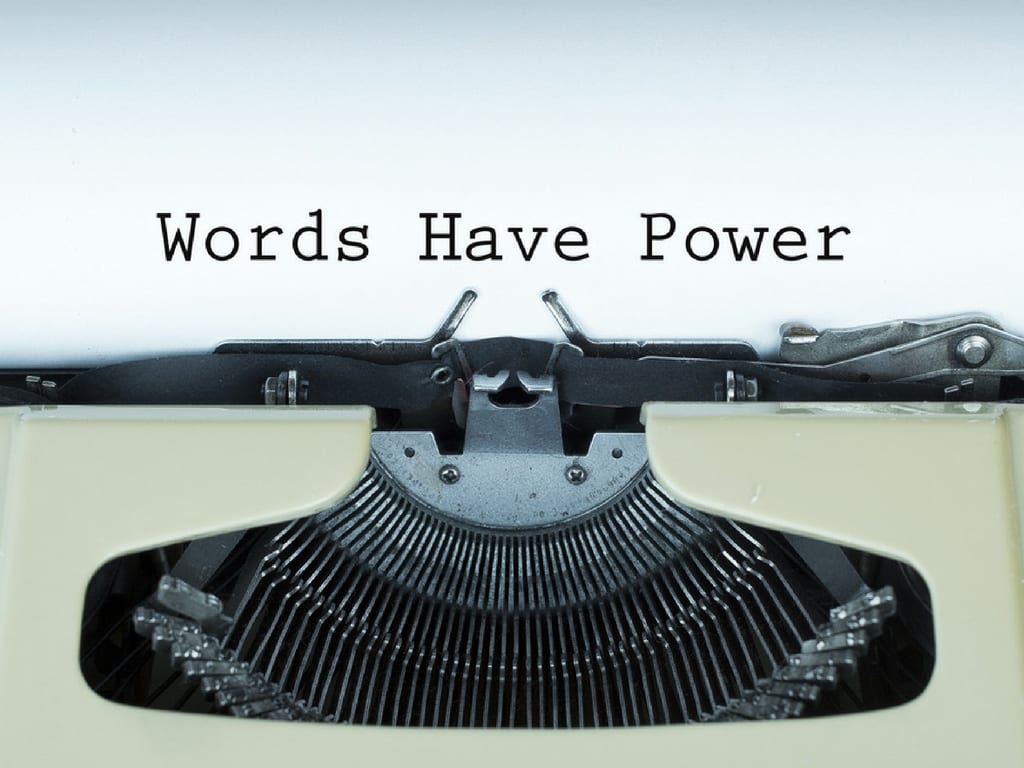 paper in typewriter with the text words have power.