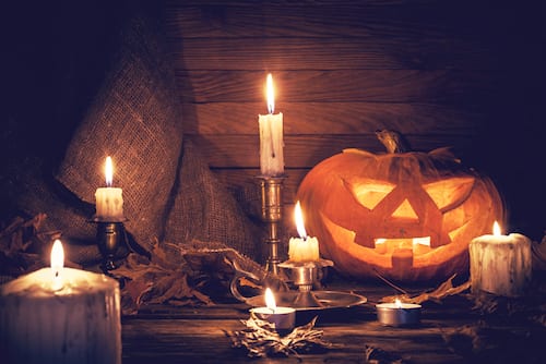 jack-o-lanterns and burning candles