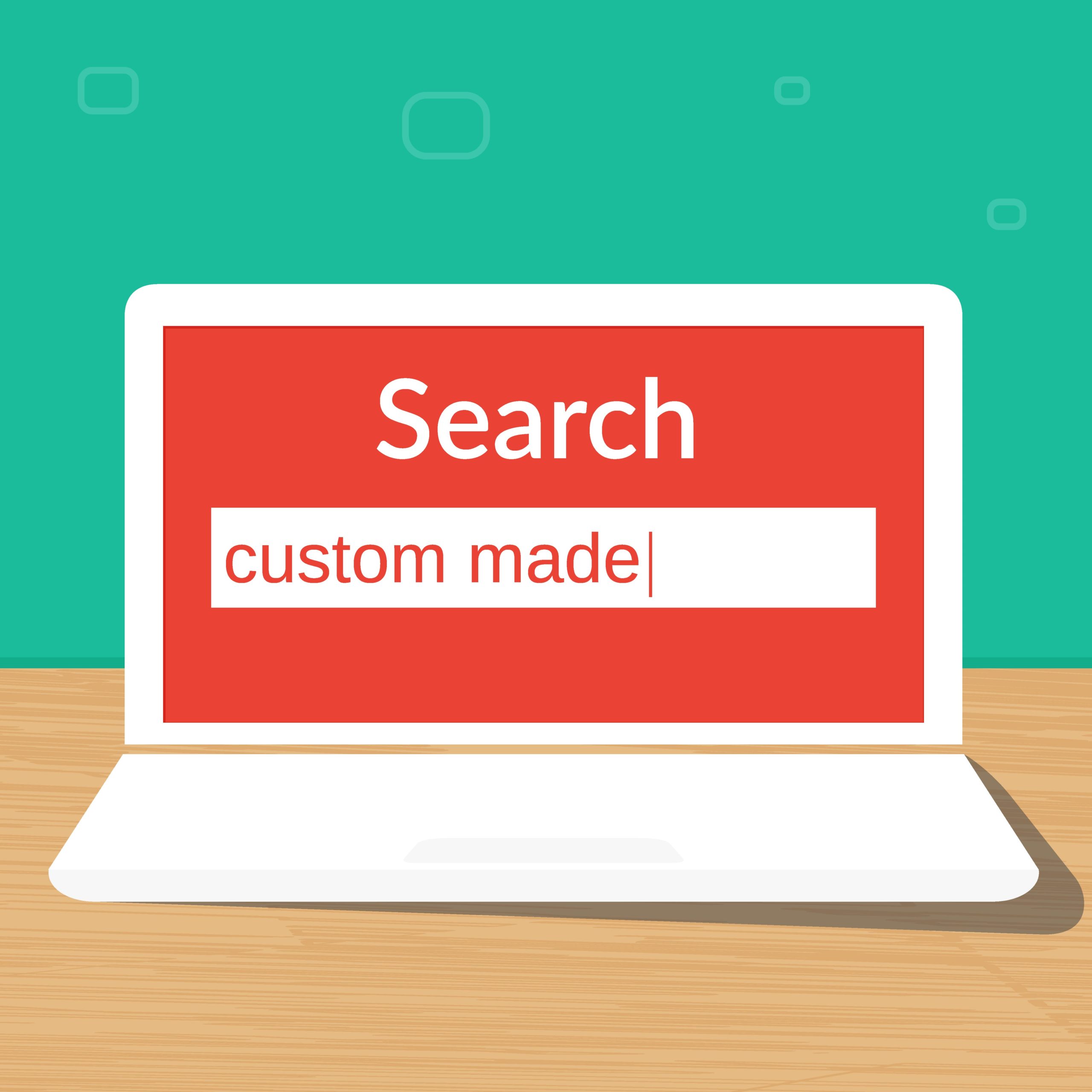 Open laptop with screen displaying "Search | Custom Made