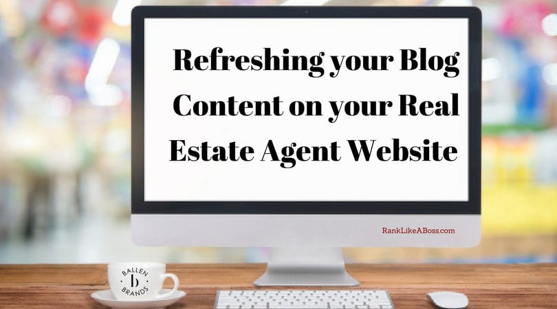 computer on a table is a desktop computer and keyboard. White coffee cup shows the Ballen Brands logo. Computer screen has words that spell out refreshing your blog content on your real estate agent website