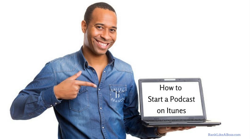 Smiling man is holding a laptop computer that reads how to start a podcast on itunes. He's pointing to it