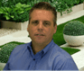 Brenden Rendo is wearing a blue shirt, and is outdoors, real estate agent in orlando florida