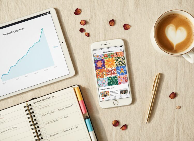 Phone showing Pinterest and a tablet with a growth chart on a linen background — tracking affiliate link clicks